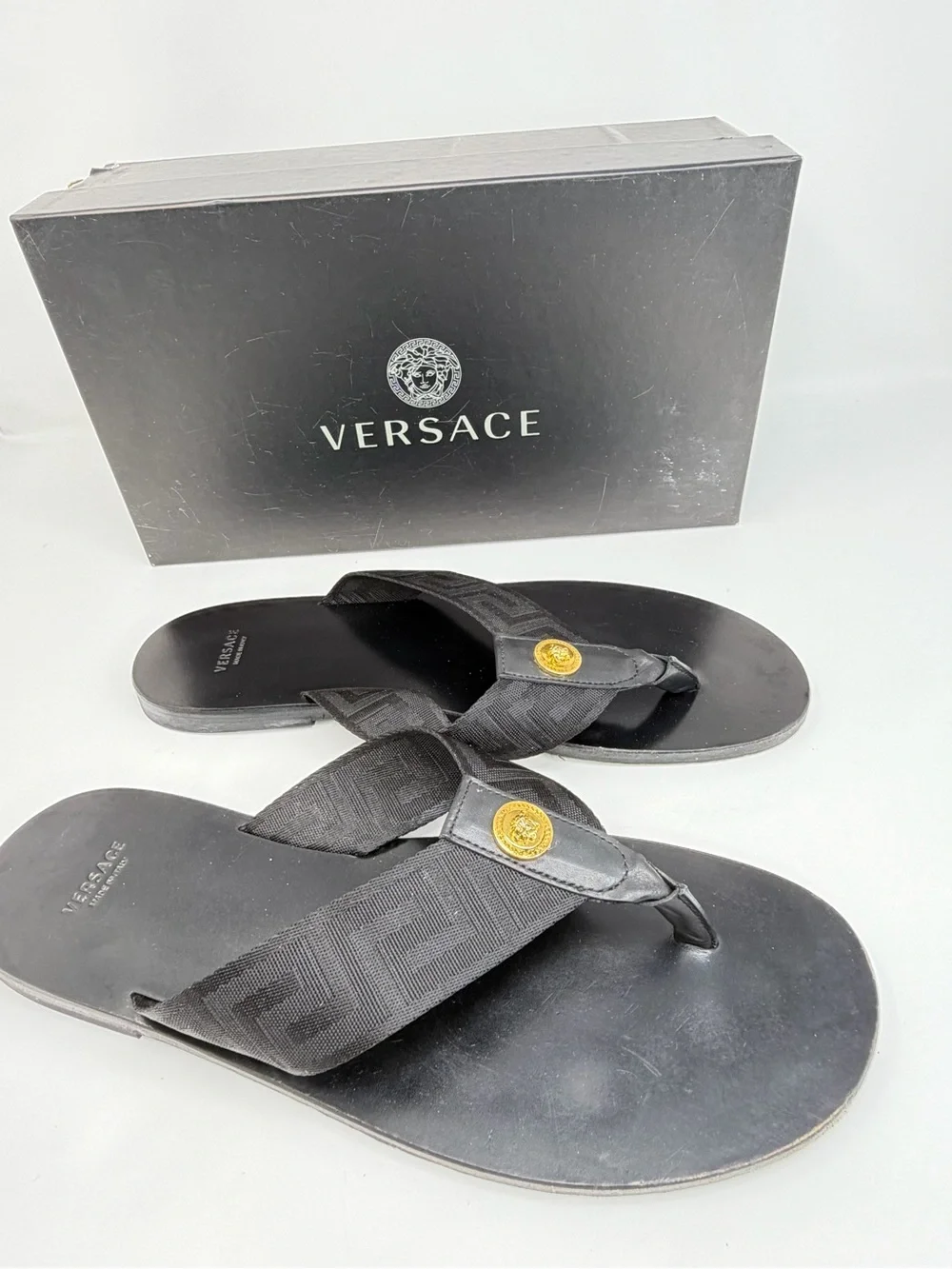 Versace Black Thong Sandals with Gold Medusa Accent